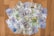 A collection of various denominations of U.S. dollar and Euro banknotes is scattered on a wooden surface. The banknotes include 20 and 100 dollar bills as well as 20 and 100 euro bills.