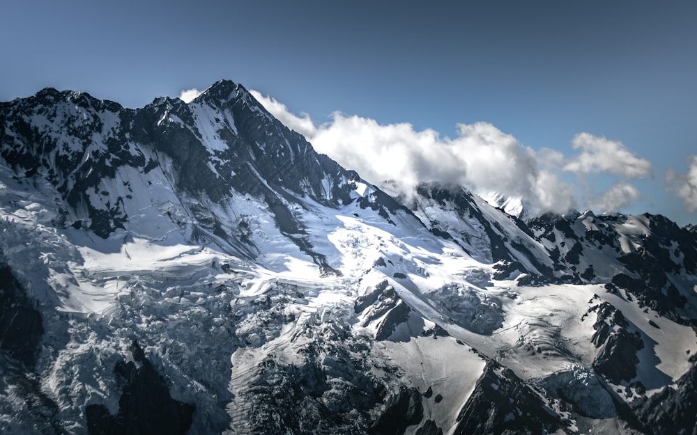 snow covered mountain under blue sky during daytime