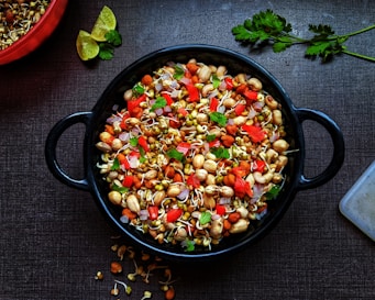 black ceramic bowl with vegetable salad