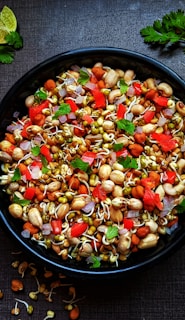 black ceramic bowl with vegetable salad