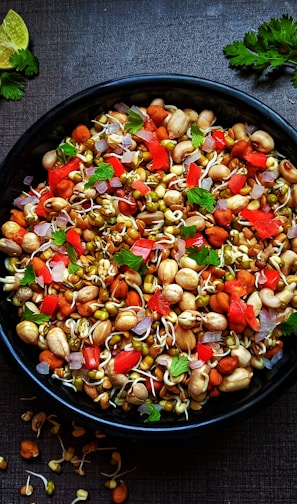 black ceramic bowl with vegetable salad