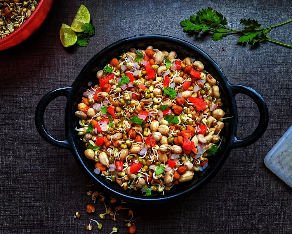 black ceramic bowl with vegetable salad