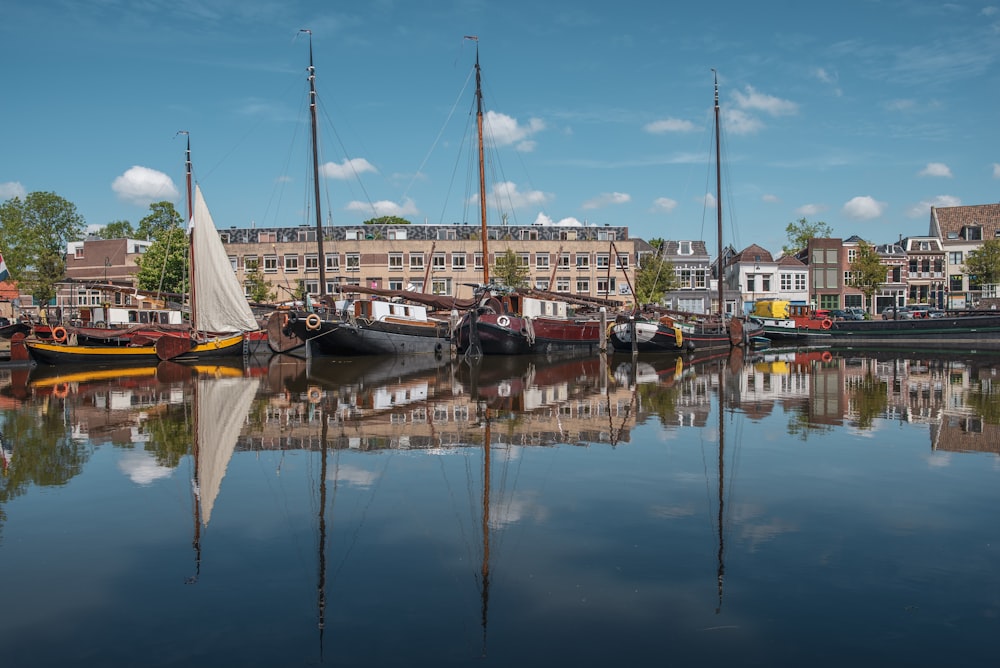 white sail boat on dock during daytime