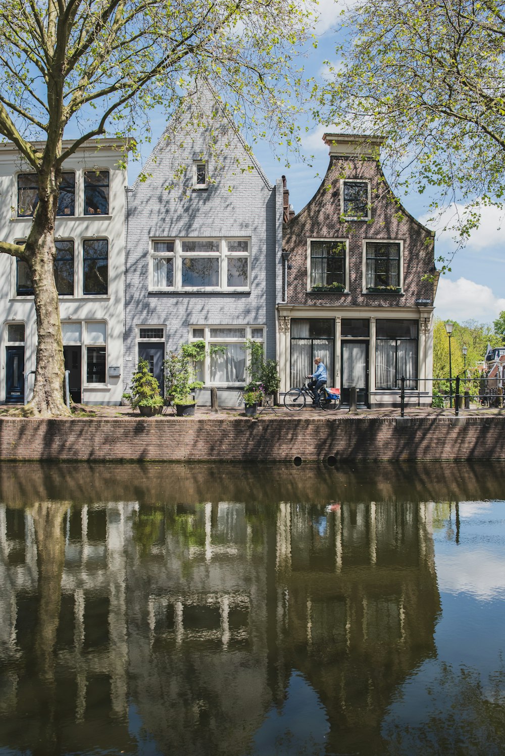 brown and white concrete building near body of water during daytime