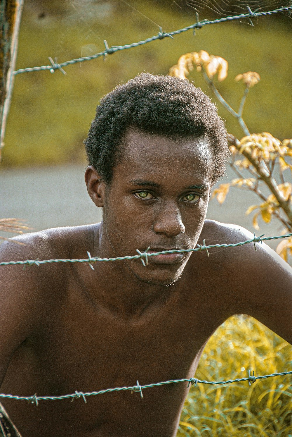 topless man with silver necklace