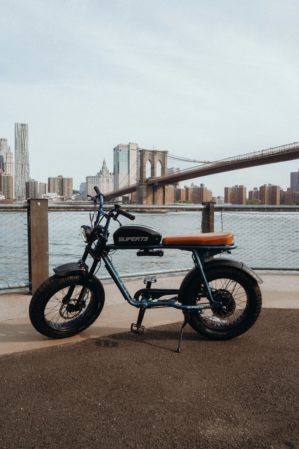 black and brown motorcycle near body of water during daytime