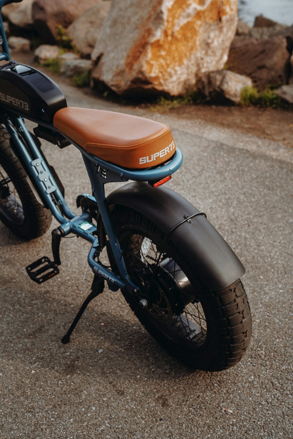 black and orange motorcycle on road during daytime