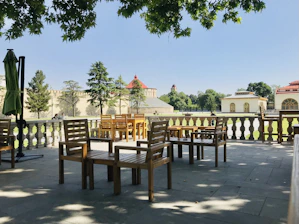 Peaceful outdoor seating area surrounded by lush greenery in Bademli.