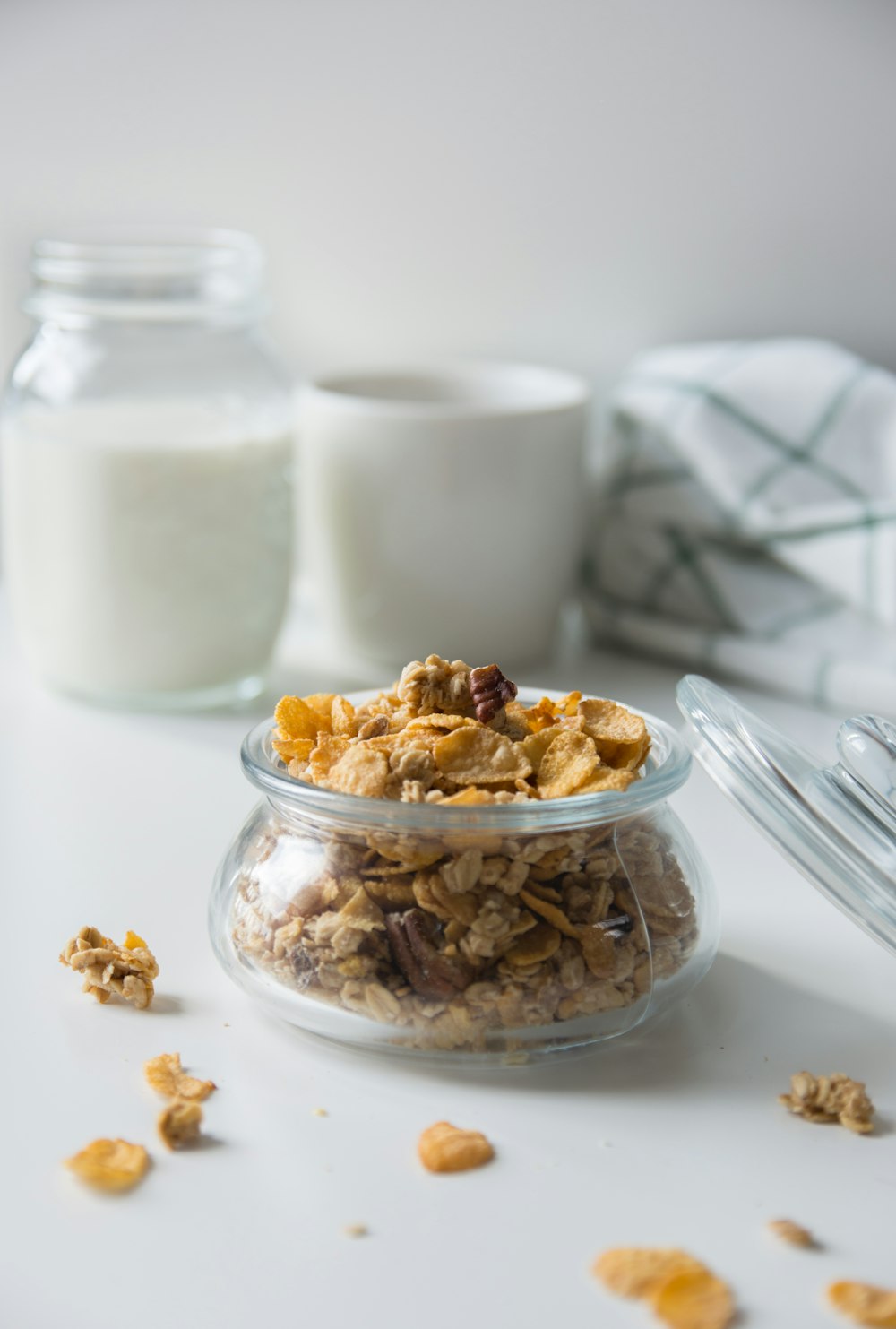 brown peanuts on clear glass bowl