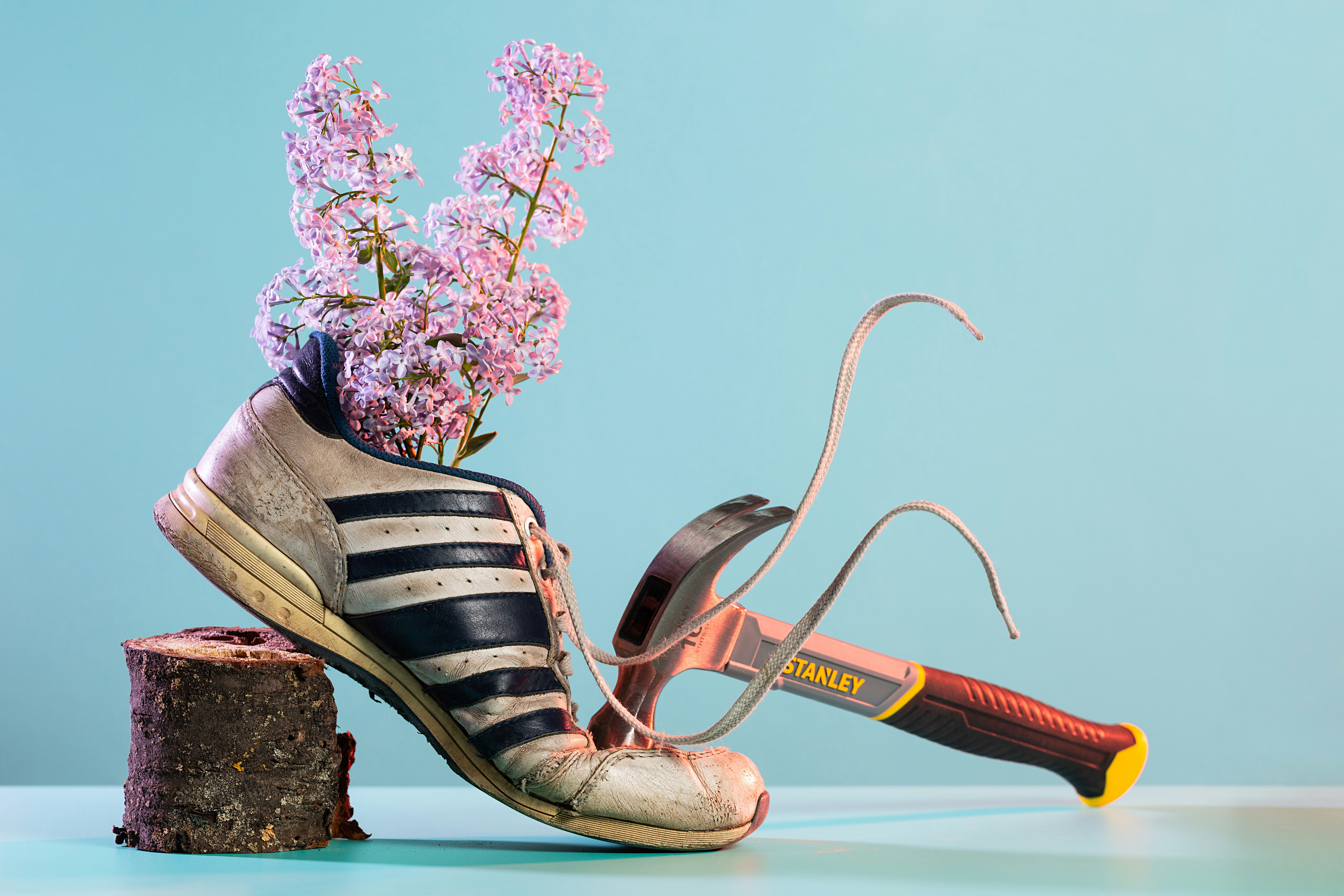 person wearing black and white striped sandals