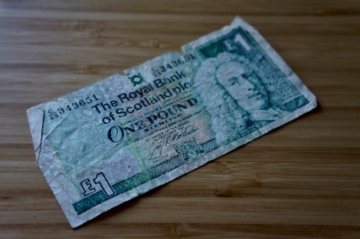 1000 banknote on brown wooden table