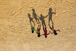 Creative shot blending imagination and reality showing children playing with shadow puppets.