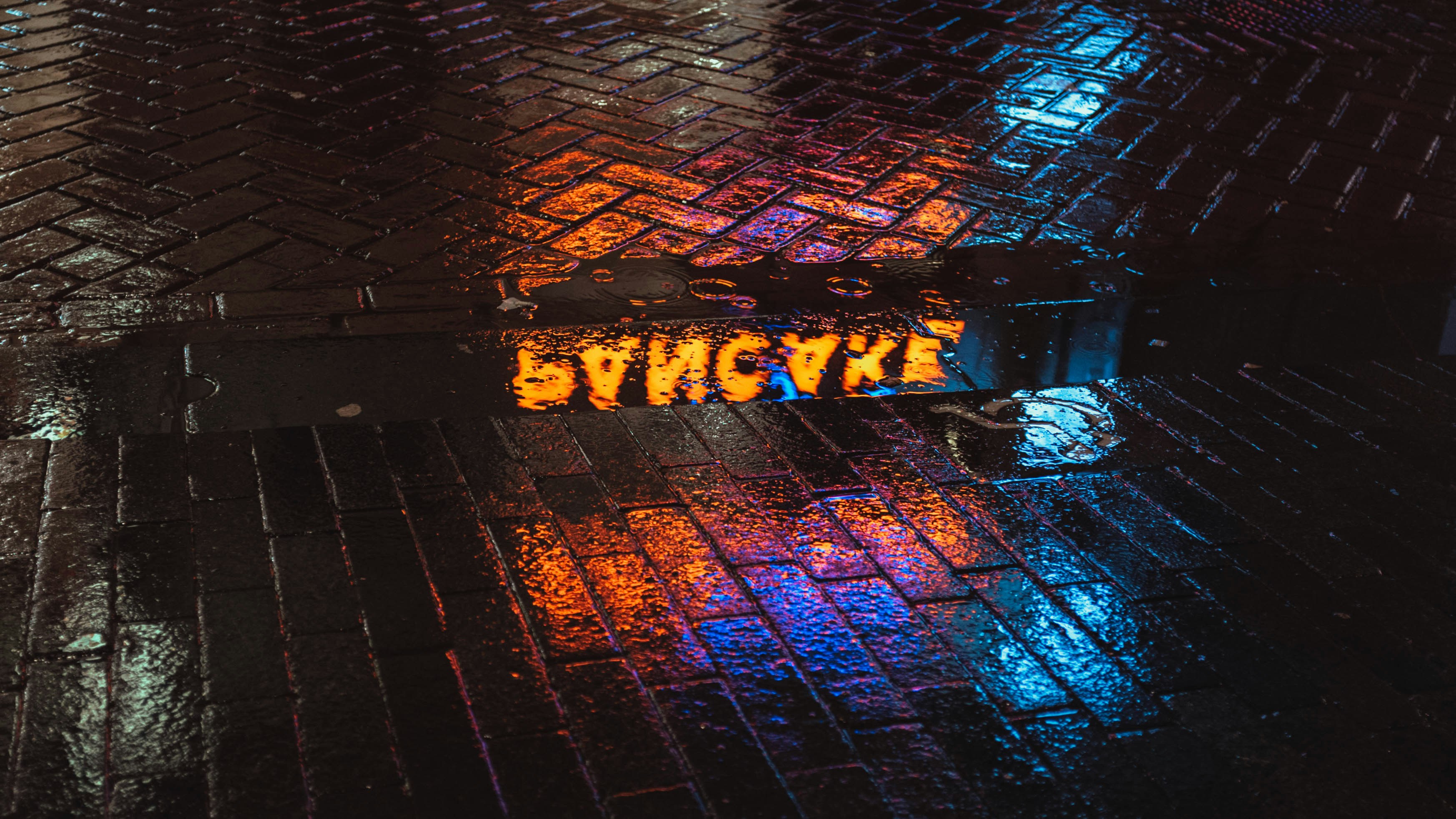 a close up of a street sign on the ground