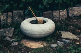 white concrete round outdoor fountain