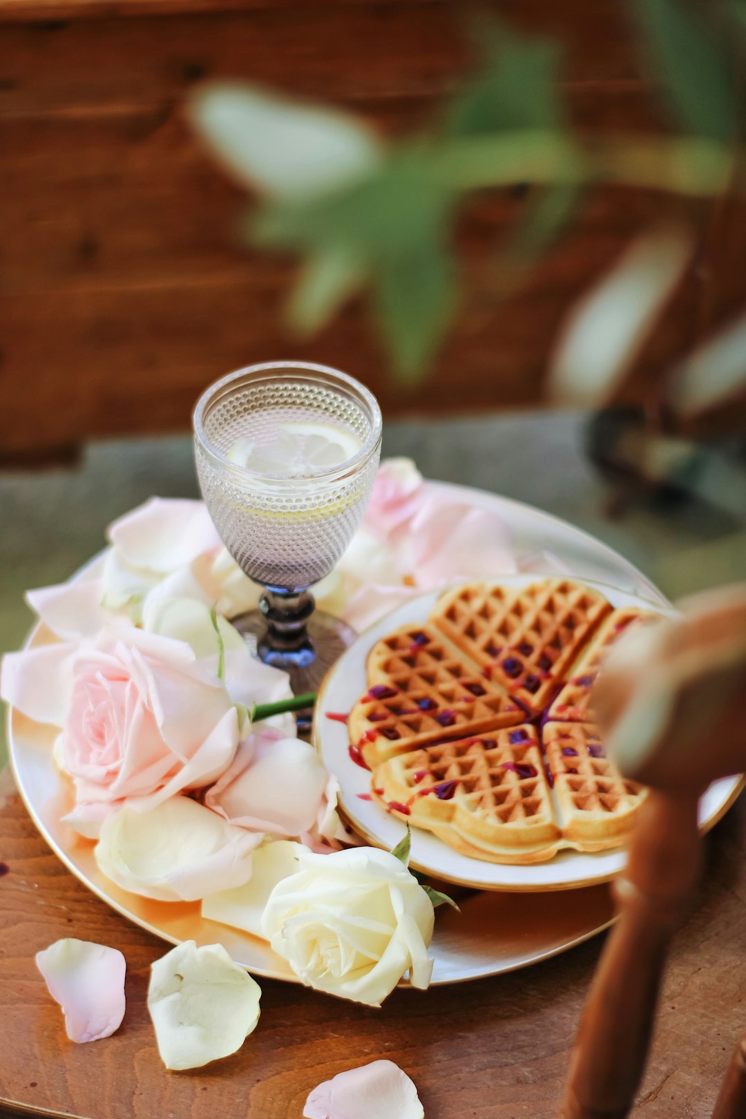 waffle with pink cream on white ceramic plate