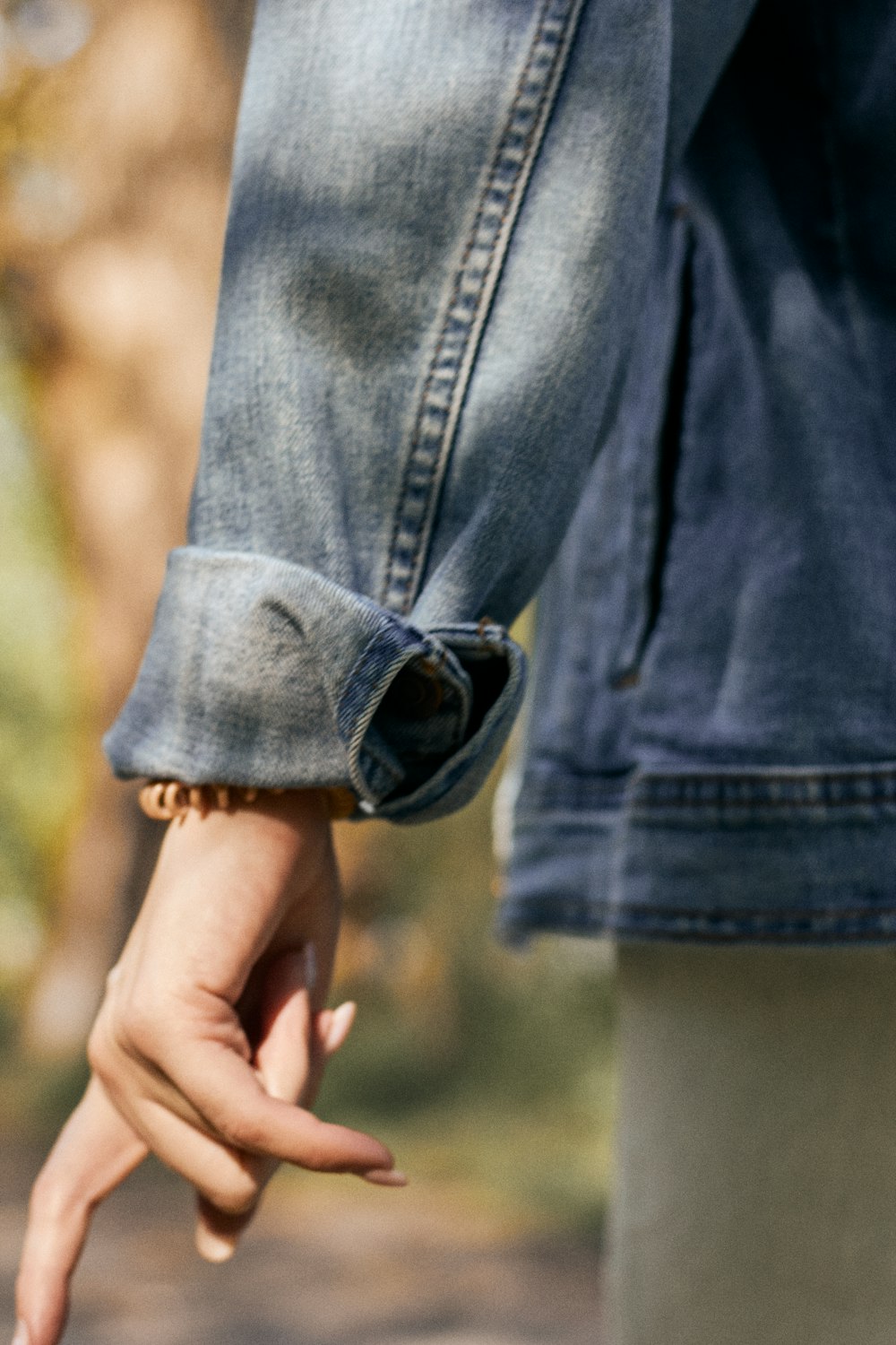 person in blue denim shorts