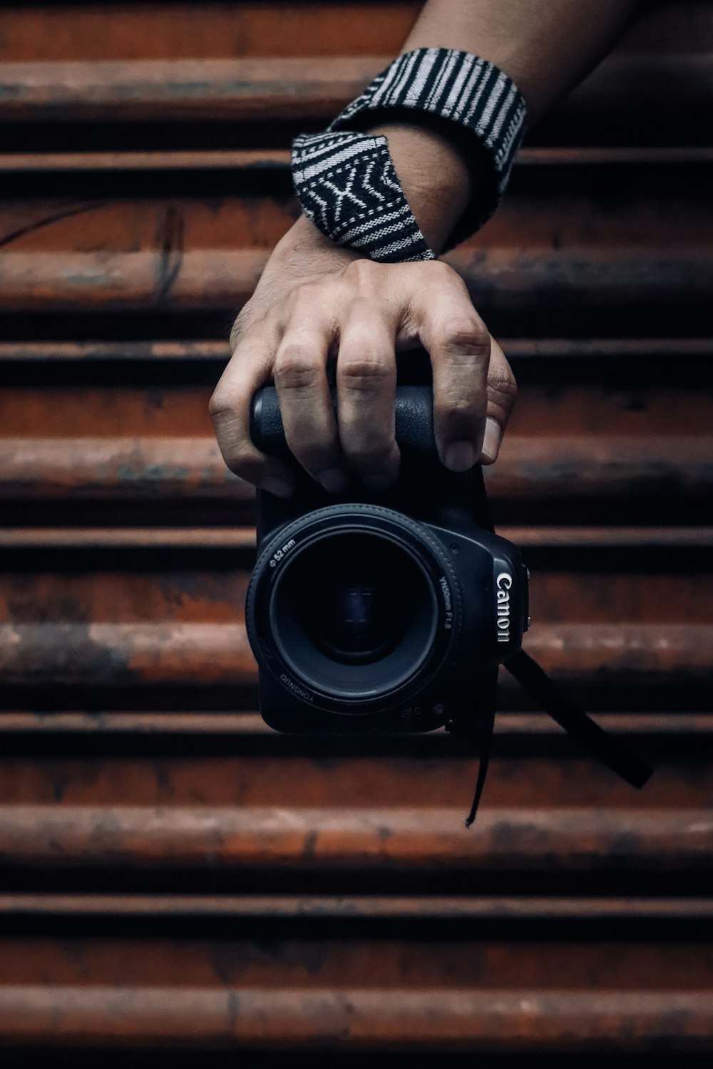 person holding black dslr camera