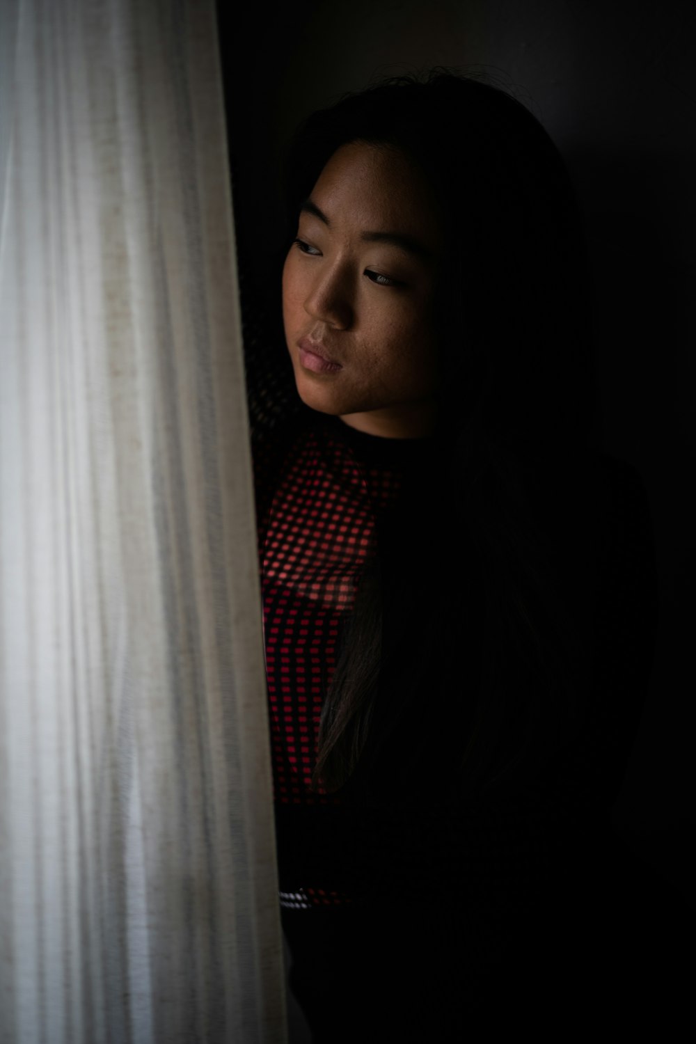 woman in red and black checkered dress shirt