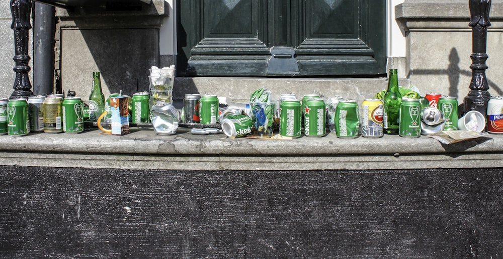 green glass bottles on window