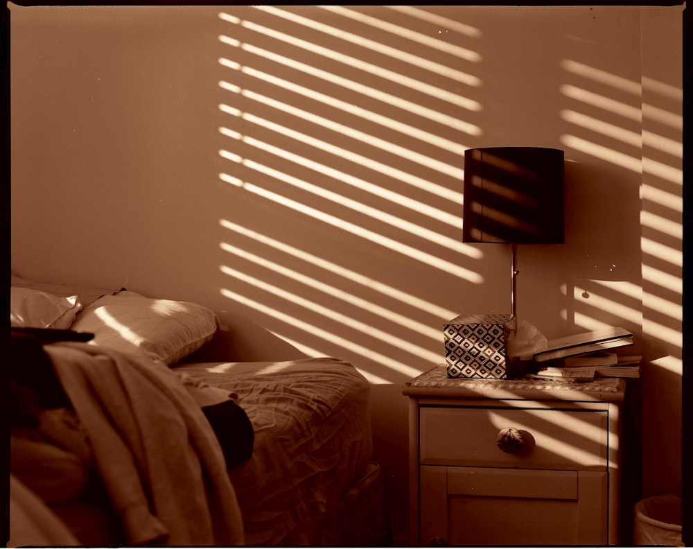 black table lamp on brown wooden drawer