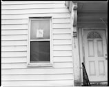 white wooden window frame on white wooden wall