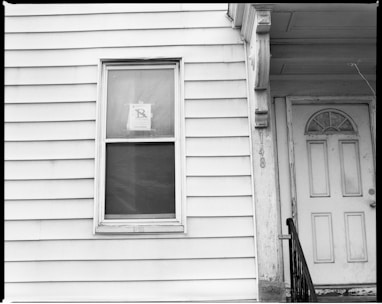 white wooden window frame on white wooden wall