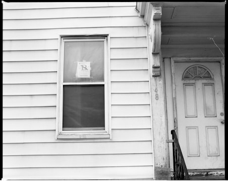 white wooden window frame on white wooden wall