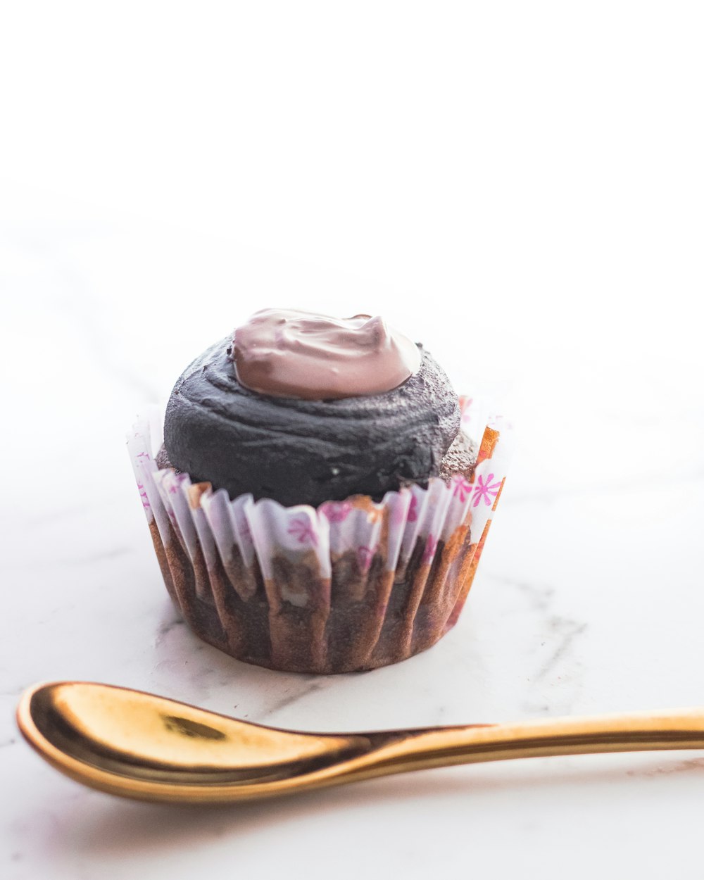 chocolate cupcake on white table