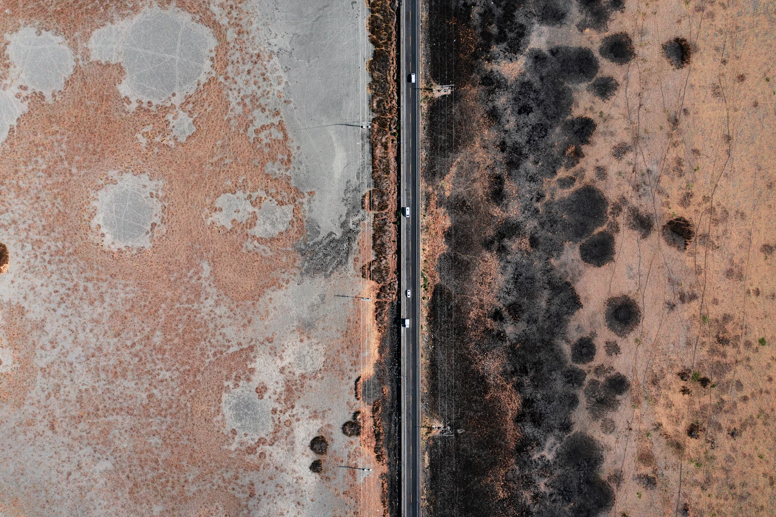 Aerial view of a road crossing dry ground in Michoacán