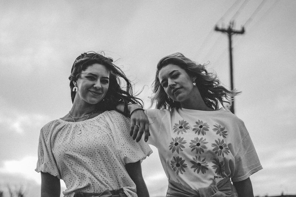 grayscale photo of 2 women smiling