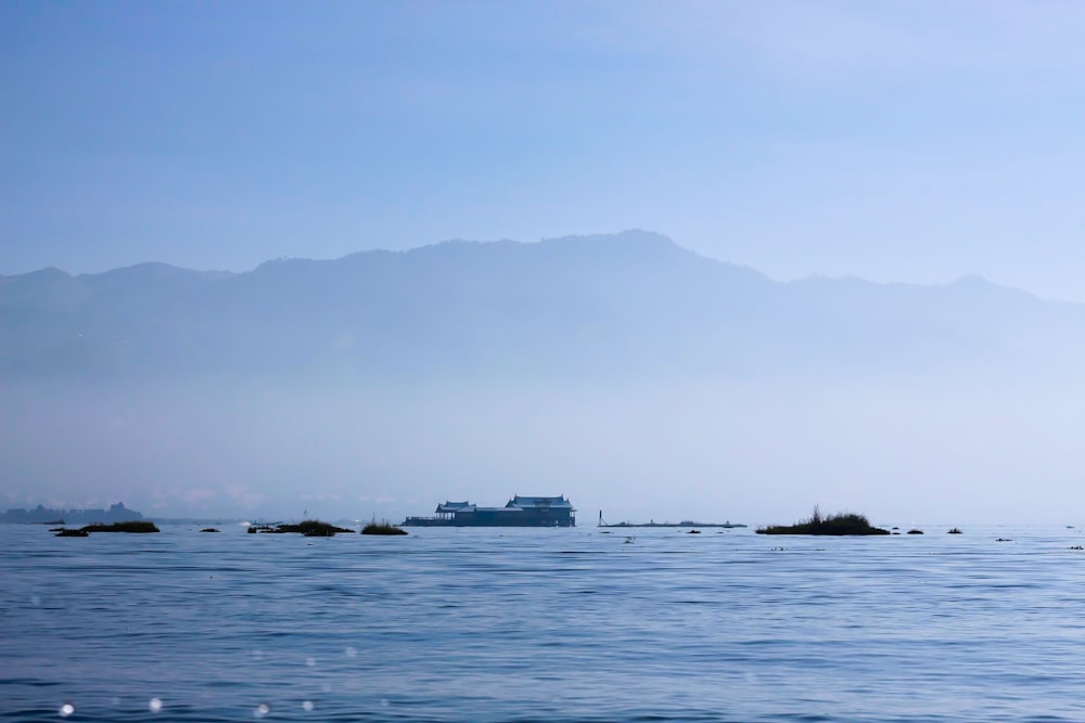 white ship on sea during daytime