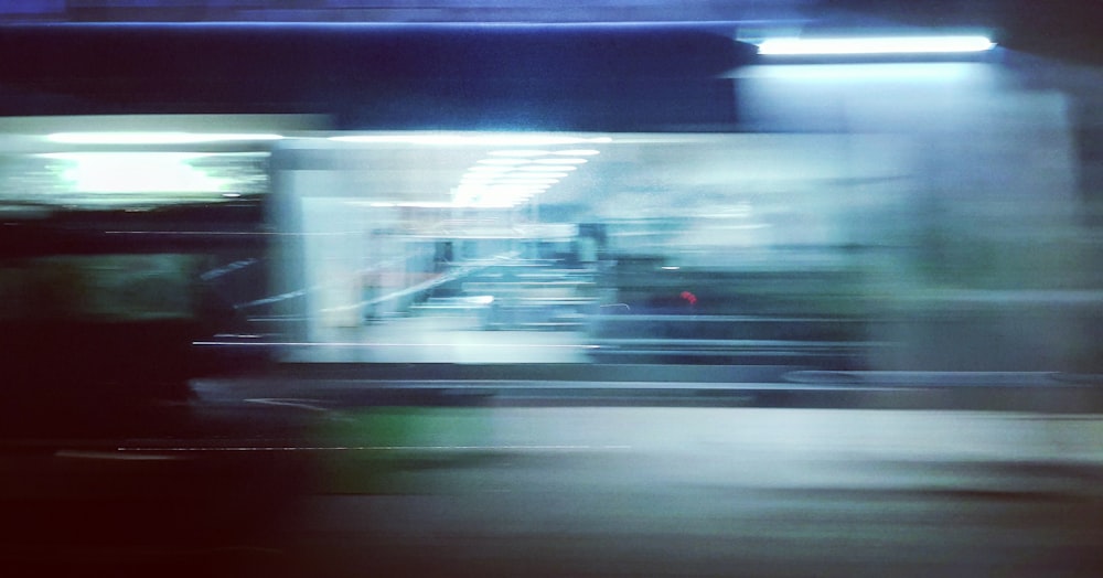 white car on road during night time