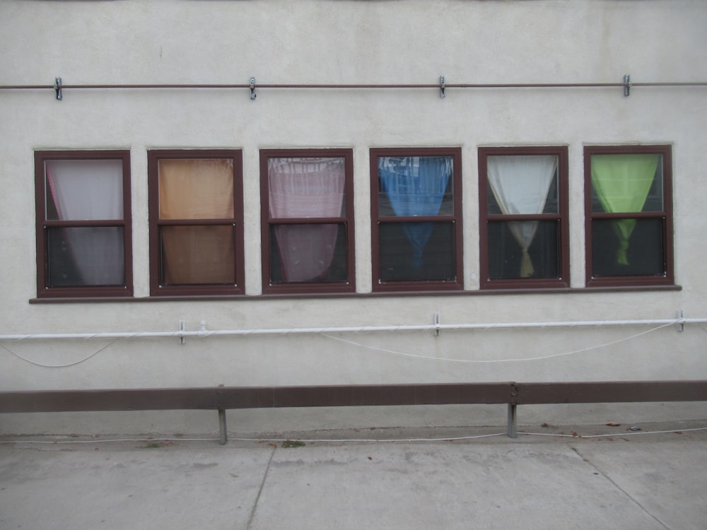 white concrete building with glass windows