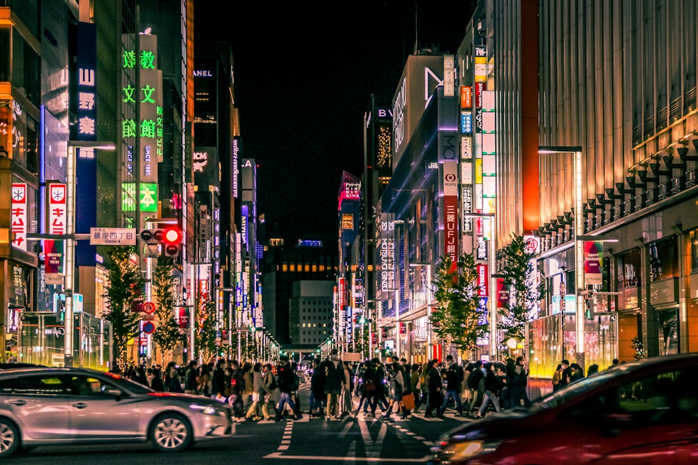 people walking on street during night time