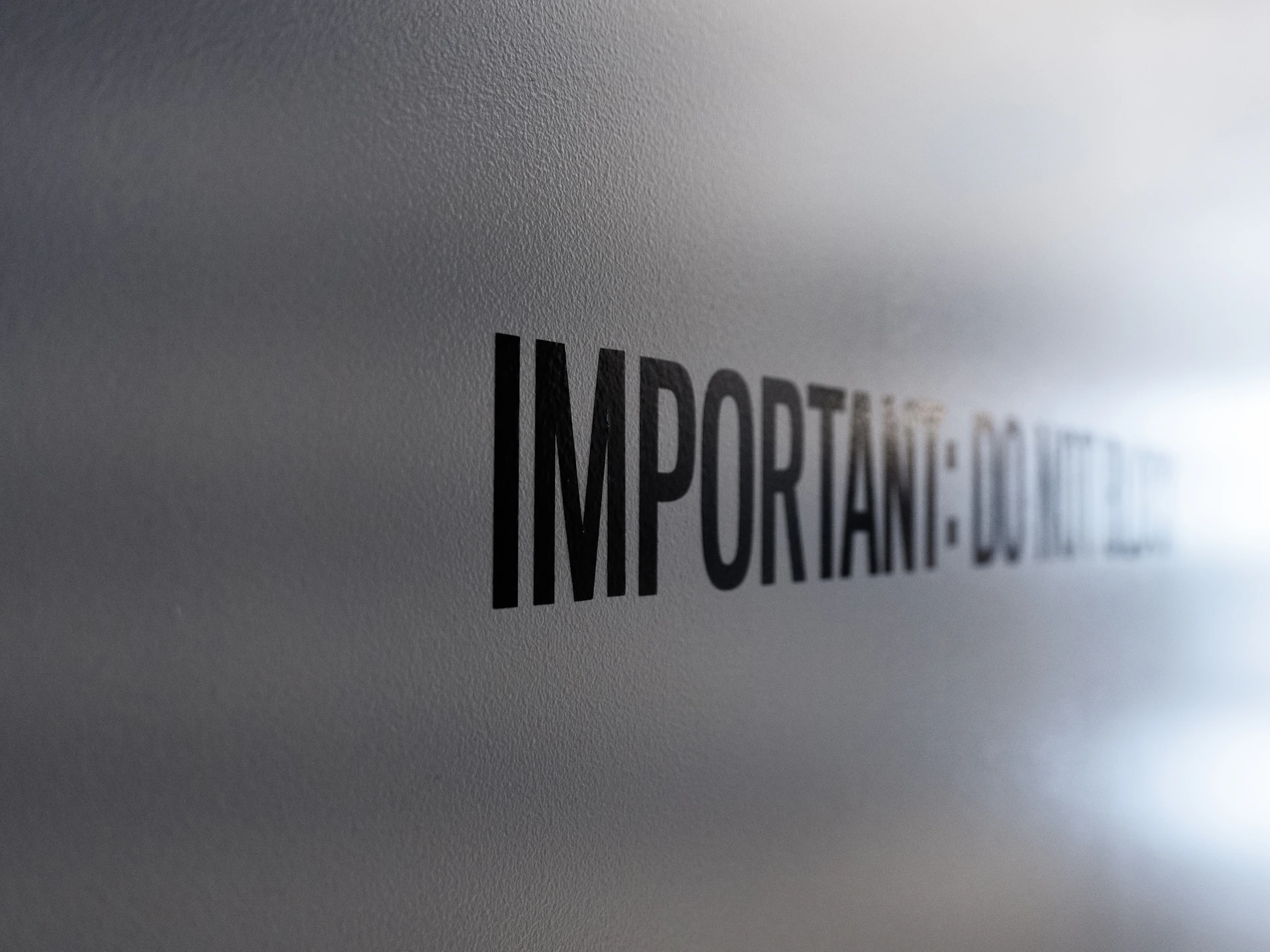 a close up of the word important on a wall