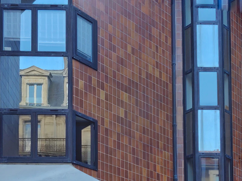 brown brick building with blue window