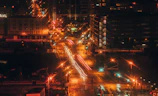 a city street filled with lots of traffic at night