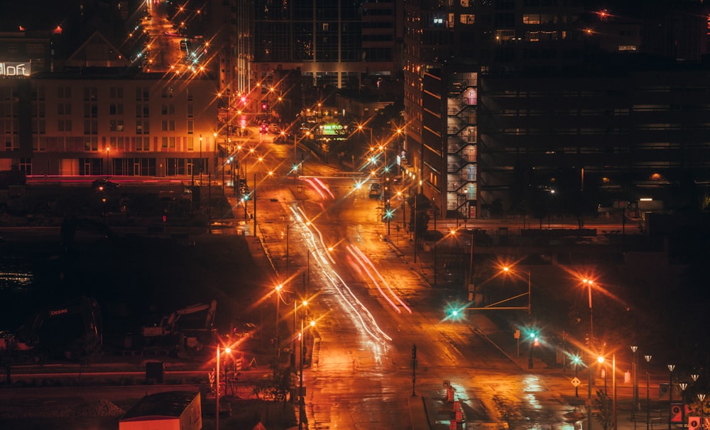 a city street filled with lots of traffic at night