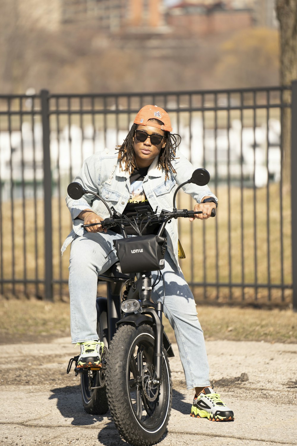 woman in gray jacket riding motorcycle