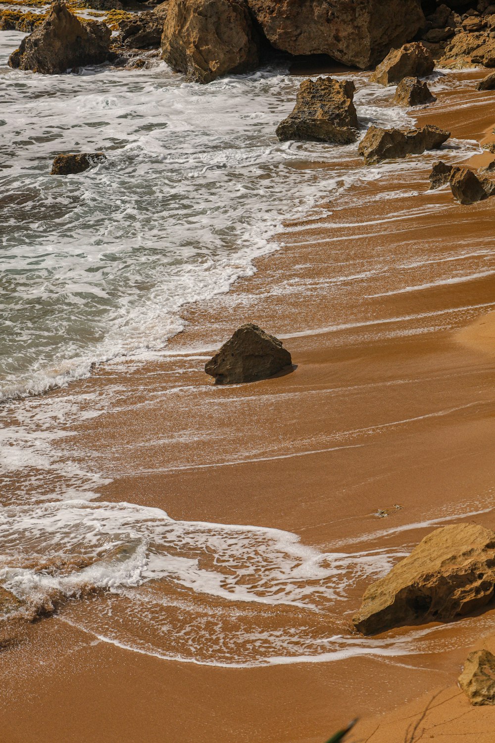 brown rock formation on seashore during daytime