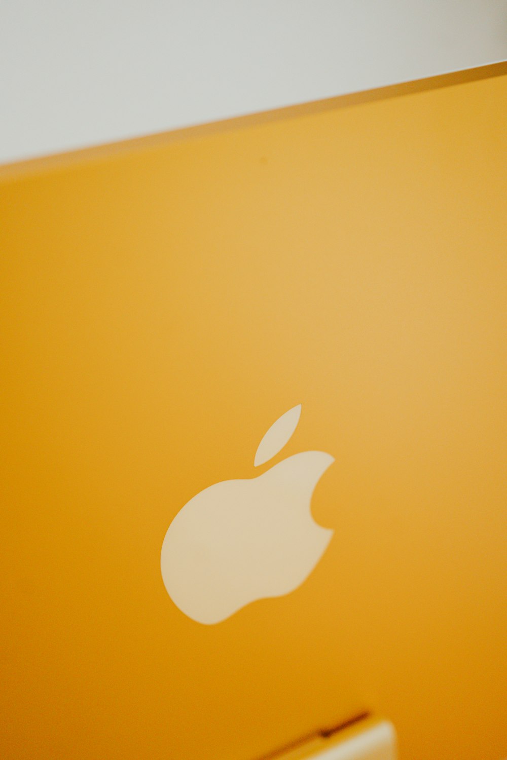 a close up of an apple laptop on a table