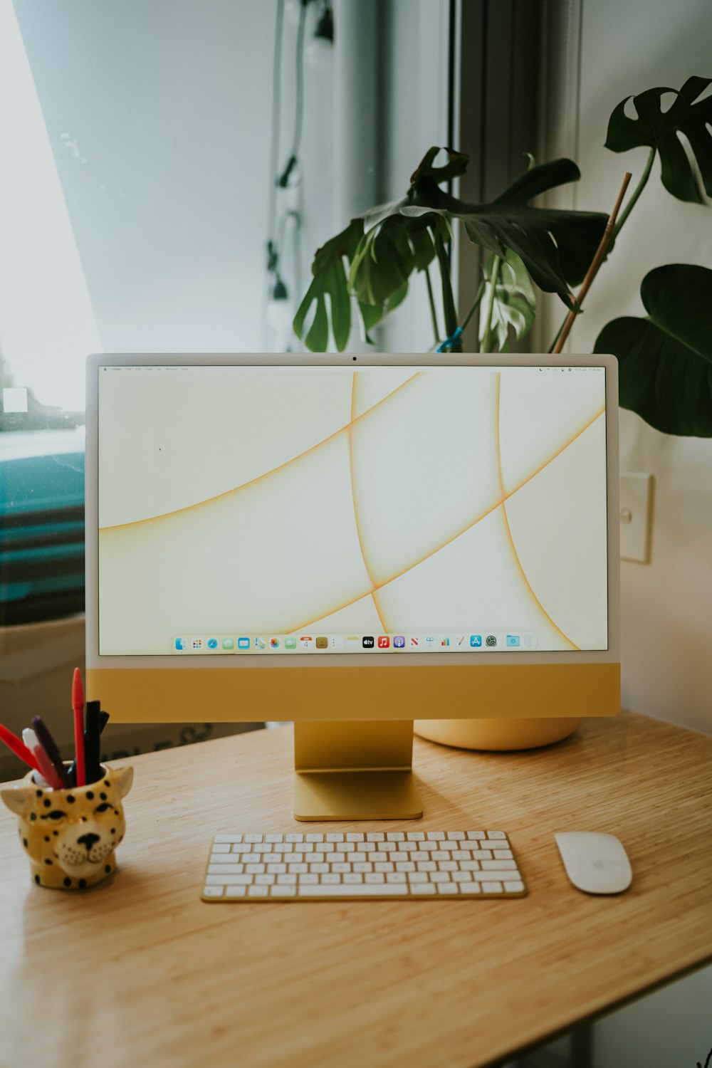 a desktop computer sitting on top of a wooden desk