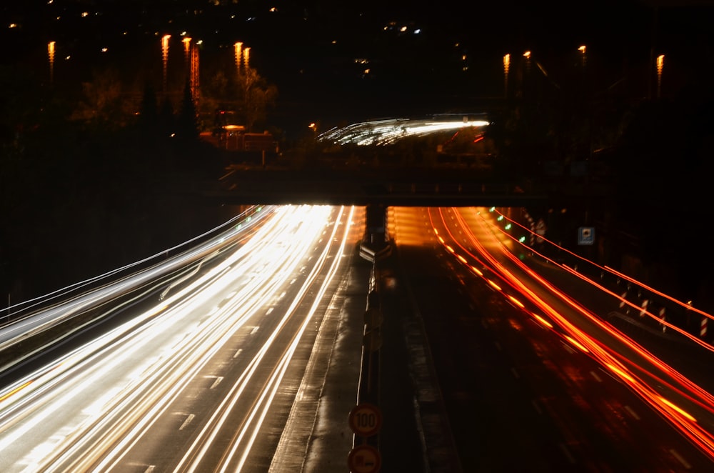 time lapse photography of cars on road during night time