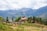A breathtaking view of the Bhutanese mountains with a luxury hotel in the foreground.