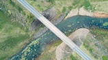 an aerial view of a bridge over a river