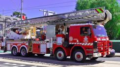 a red fire truck parked on the side of the road