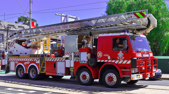 a red fire truck parked on the side of the road