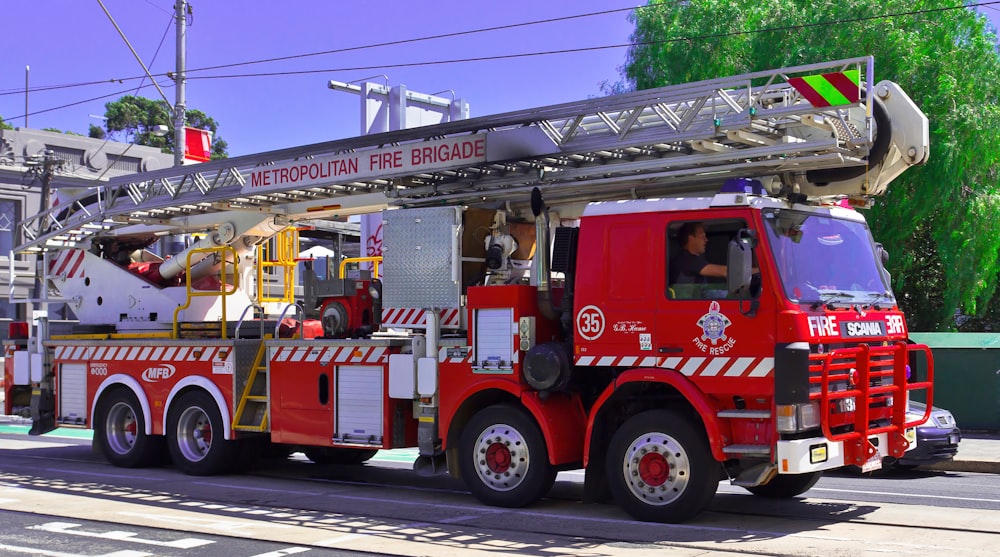 a red fire truck parked on the side of the road