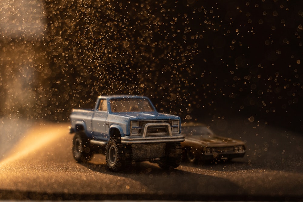 a toy truck and a toy car on a road
