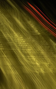 Abstract high-speed motion blur with neon blue and green streaks symbolizing rapid data flow.